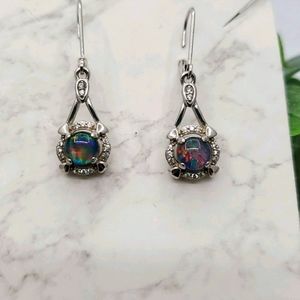 Sterling silver imitation opal earrings.